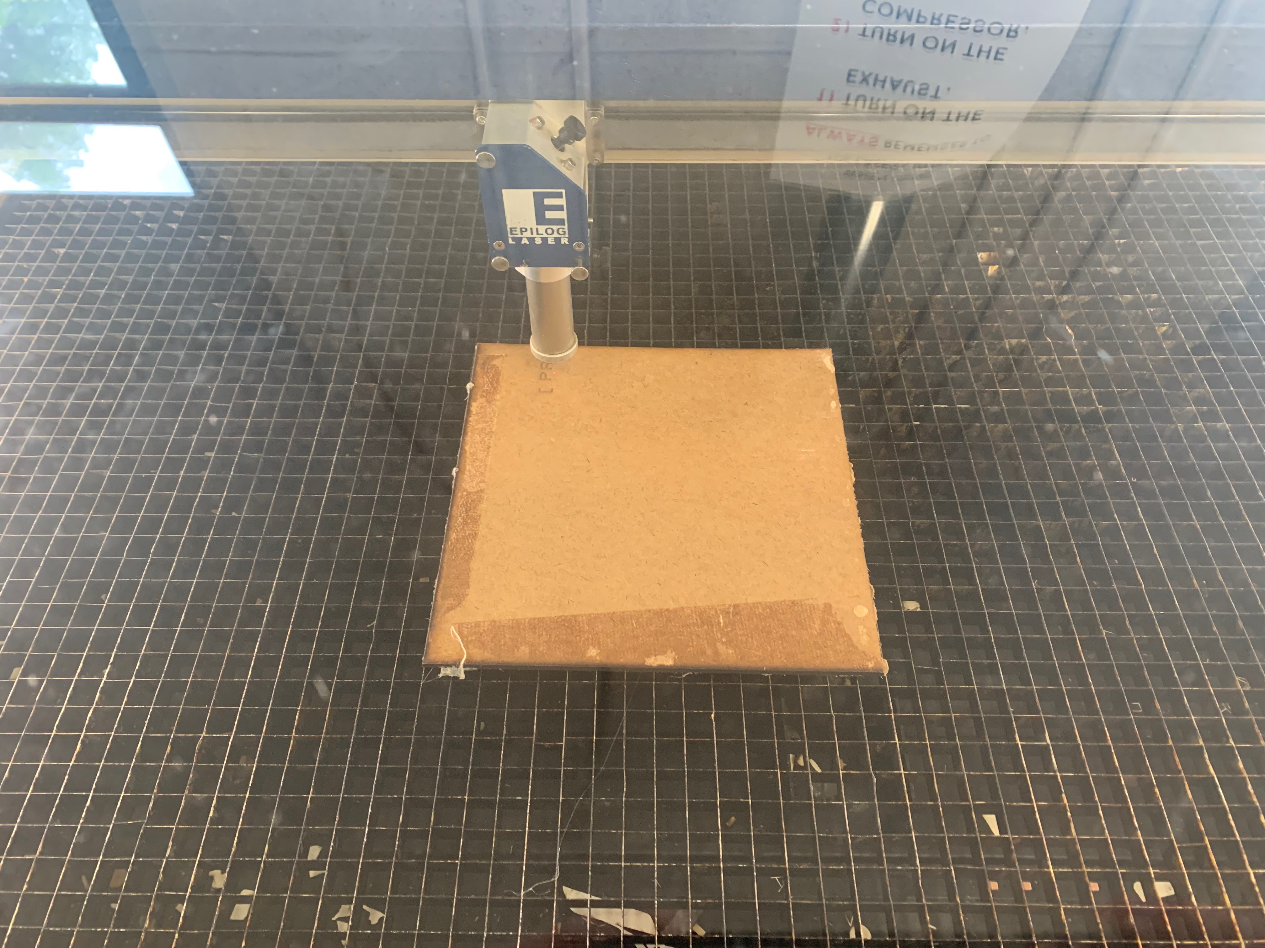 Picture of cardboard in laser cutter